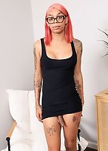 In this solo set, black tgirl Wynter in nerdy glasses shows off her gorgeous tattooed body, fantastic round ass, pretty feet, and delicious cock
